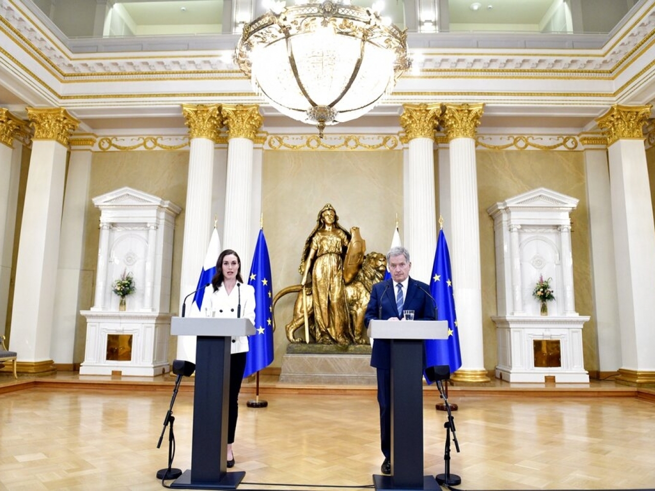 Finland's President Sauli Niinisto and Prime Minister Sanna Marin attend a press conference at the Presidential Palace in Helsinki. Photo: AP