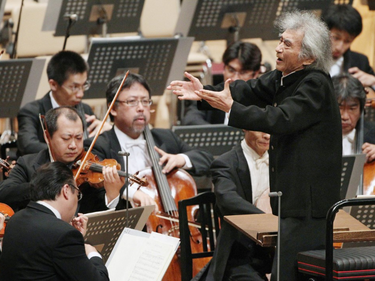 Conductor Seiji Ozawa's bushy hair and smile had charmed audiences. File photo: AFP
