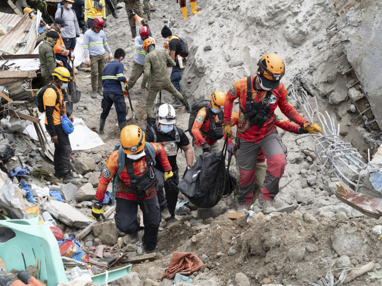 Rescue workers at the scene of the landslide. Photo: AP