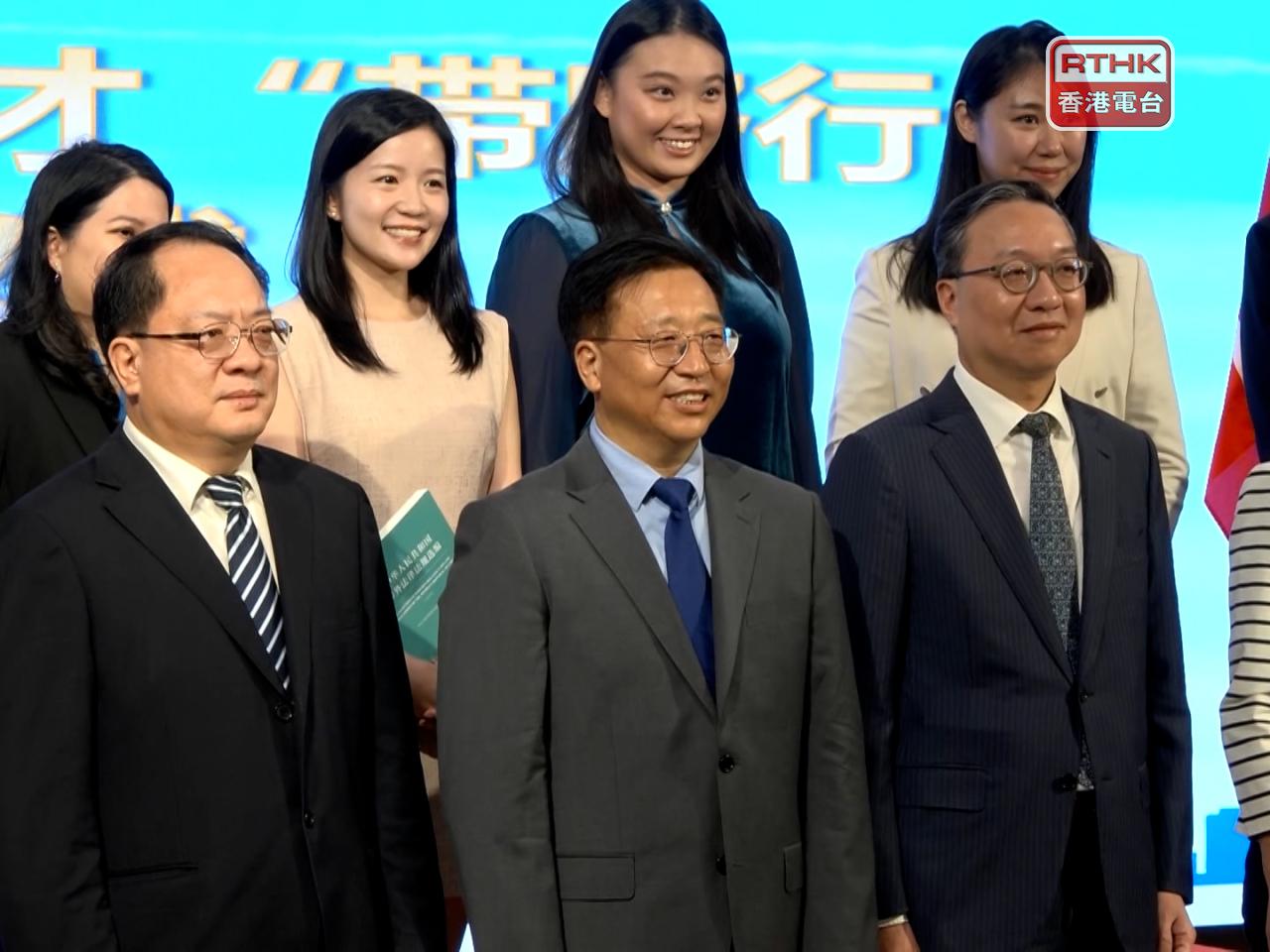 Commissioner of the Foreign Ministry's Office Cui Jianchun, centre, told participants of an exchange programme they need to visit up north to be able to tell a good story. Photo: RTHK