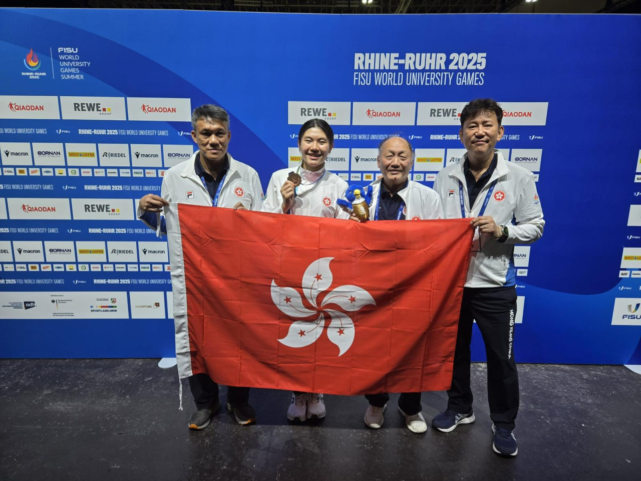 Summer Sit, second left, won the bronze in the women's sabre individual event. Photo courtesy of The University Sports Federation of Hong Kong, China