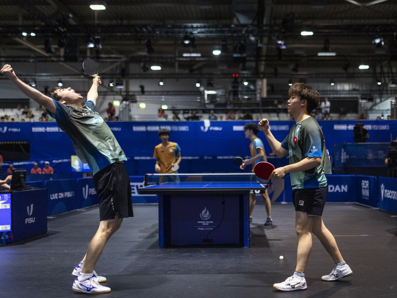 Baldwin Chan (right) and Yiu Kwan-to celebrate after winning gold in the men's doubles. Photo courtesy of FISU