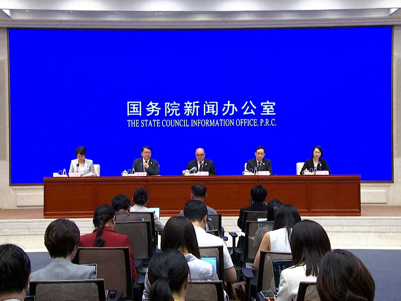Eric Chan, second left, says Hong Kong, Macau and Guangdong have set up a multi-tiered communication system for the National Games. Photo: RTHK