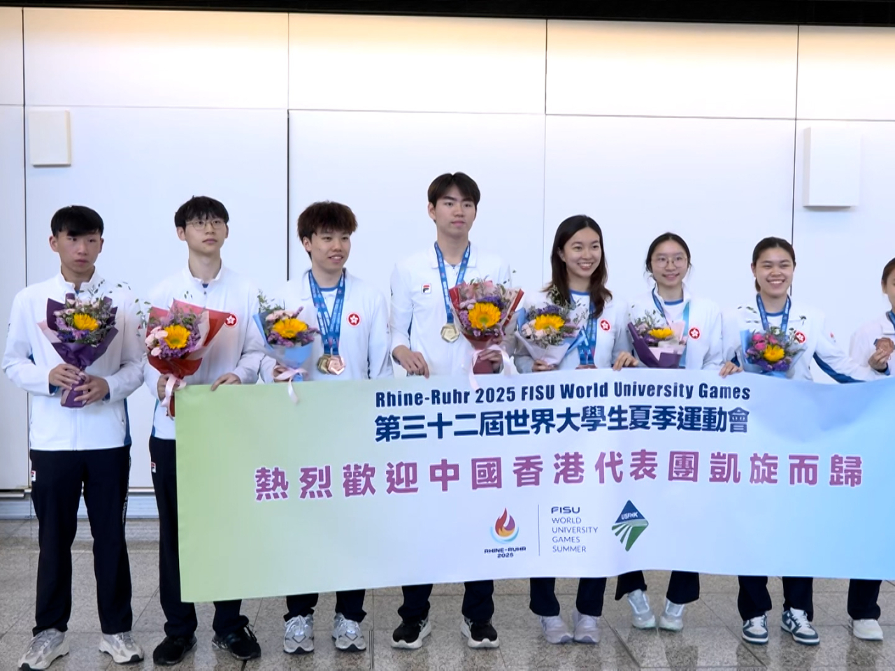 A welcome ceremony was held at the airport for the SAR's table tennis team, having won one gold and three bronze medals at the World University Games. Photo: RTHK
