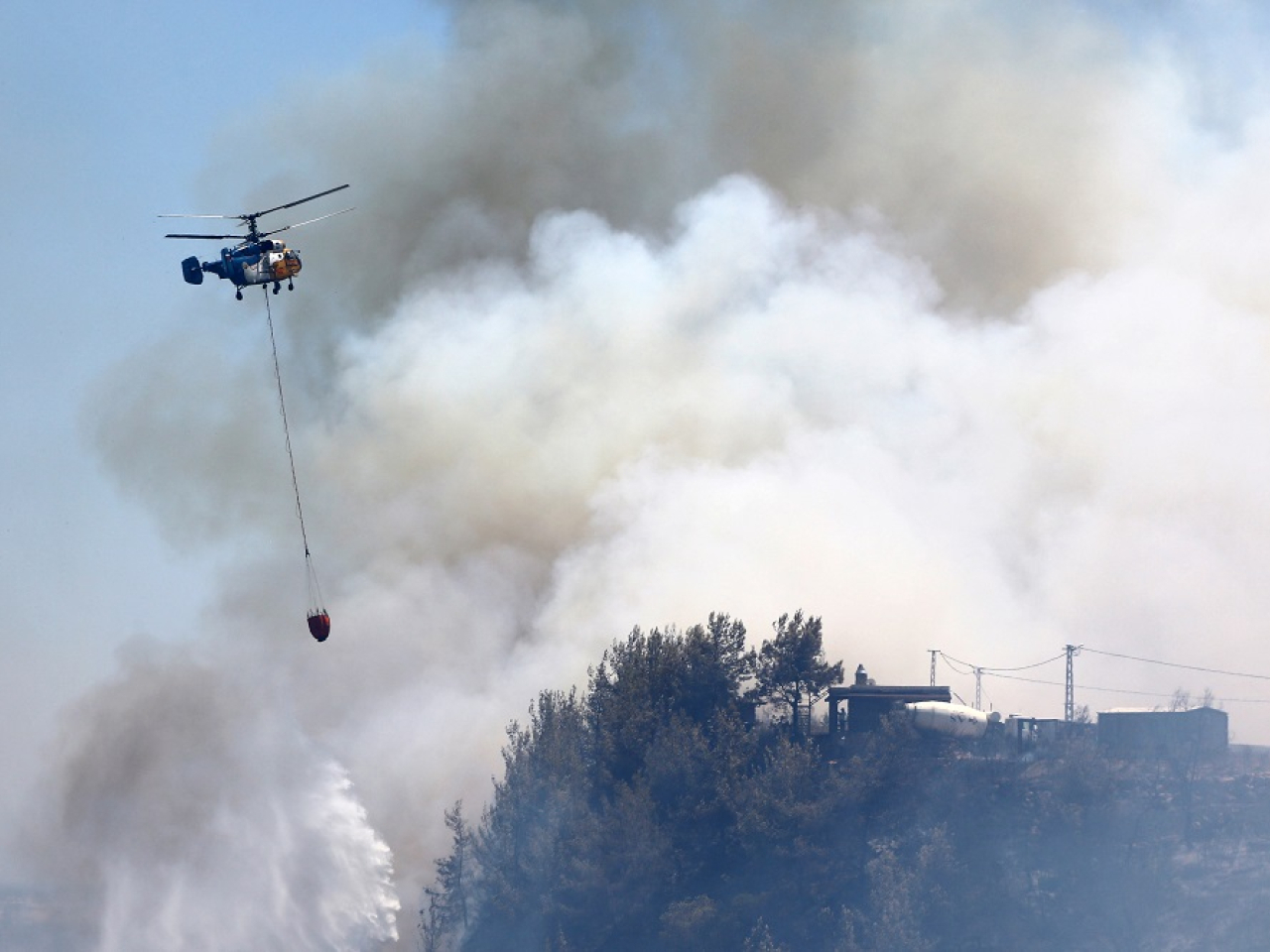 The country is currently in the grip of a heatwave and is fighting fires in a number of regions. Photo: Reuters