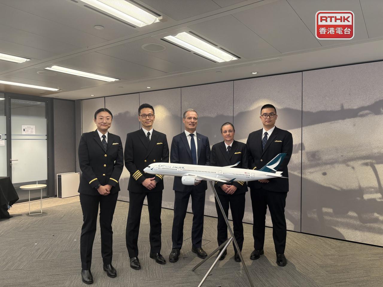 Cathay's director of flight operations Chris Kempis (centre) says the airline may expand its cadet training programme to recruit trainees from outside the country. Photo: RTHK