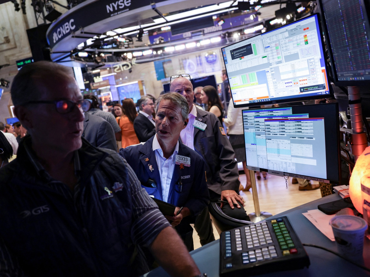 Traders work on the floor at the New York Stock Exchange. Photo: Reuters