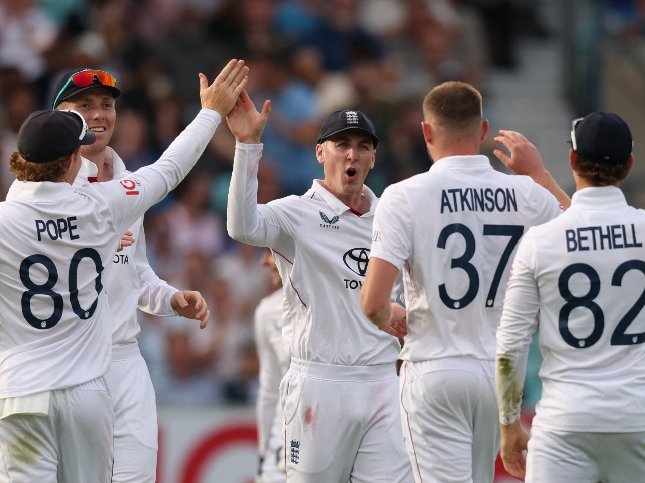 Gus Atkinson and Harry Brook celebrate on the opening day of England's series decider against India. Photo: Reuters
