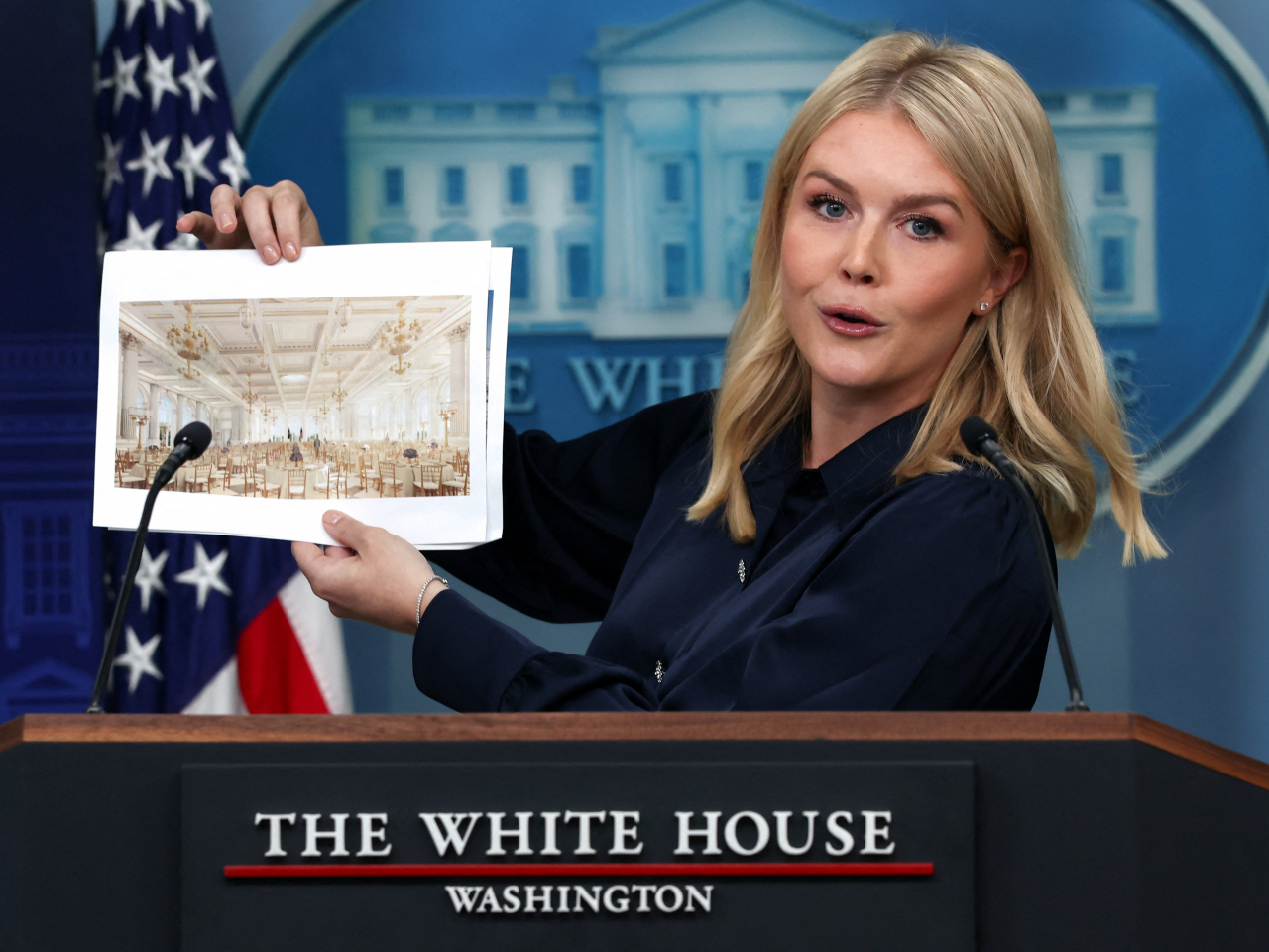 White House press secretary Karoline Leavitt holds up an artist's conception of the US$200 million White House ballroom to be built. Photo: Reuters