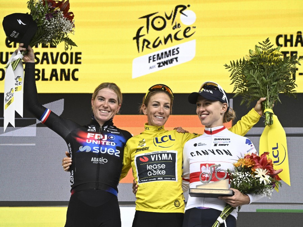Pauline Ferrand-Prevot (centre) took the overall title by a 3min 42sec margin over Dutch rider Demi Vollering (left). Photo: AFP