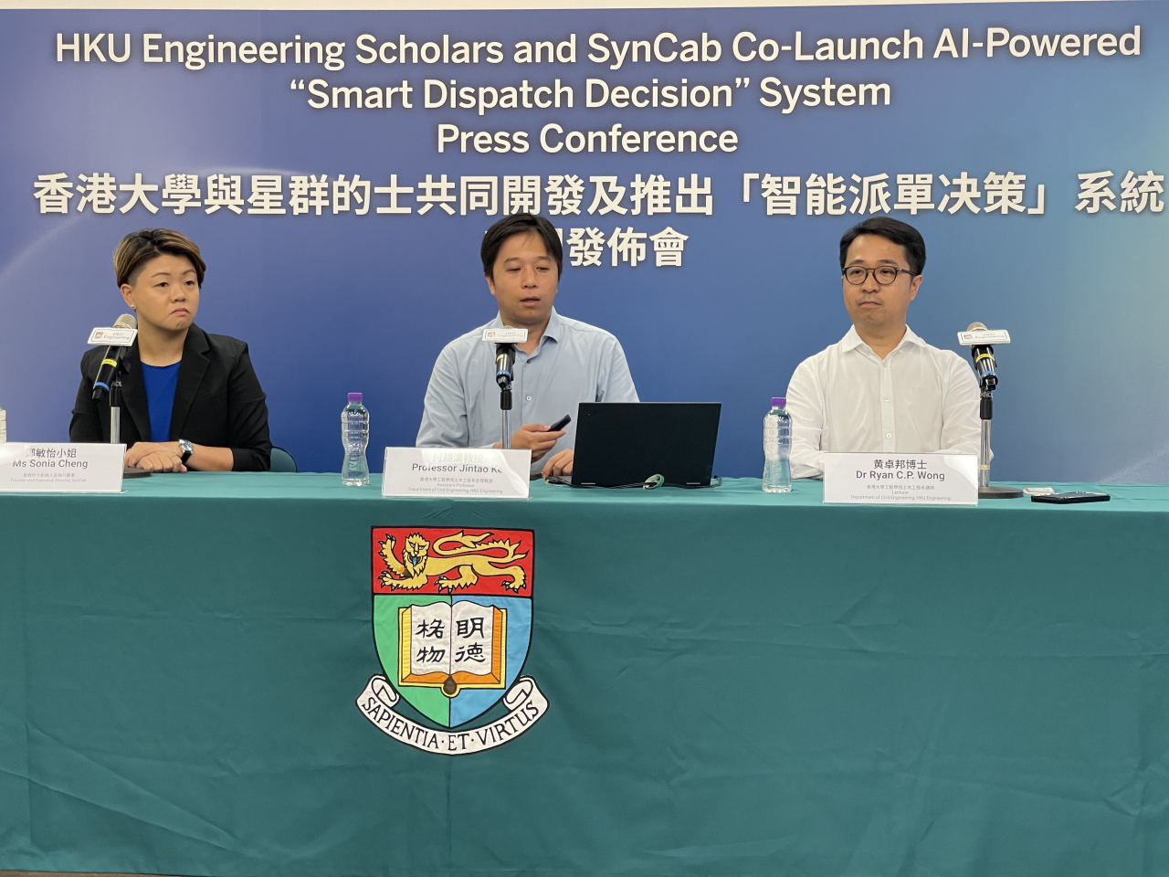 Professor Ke Jintao, centre, says the system is able to tackle the problem of drivers cruising the streets without passengers. Photo: RTHK
