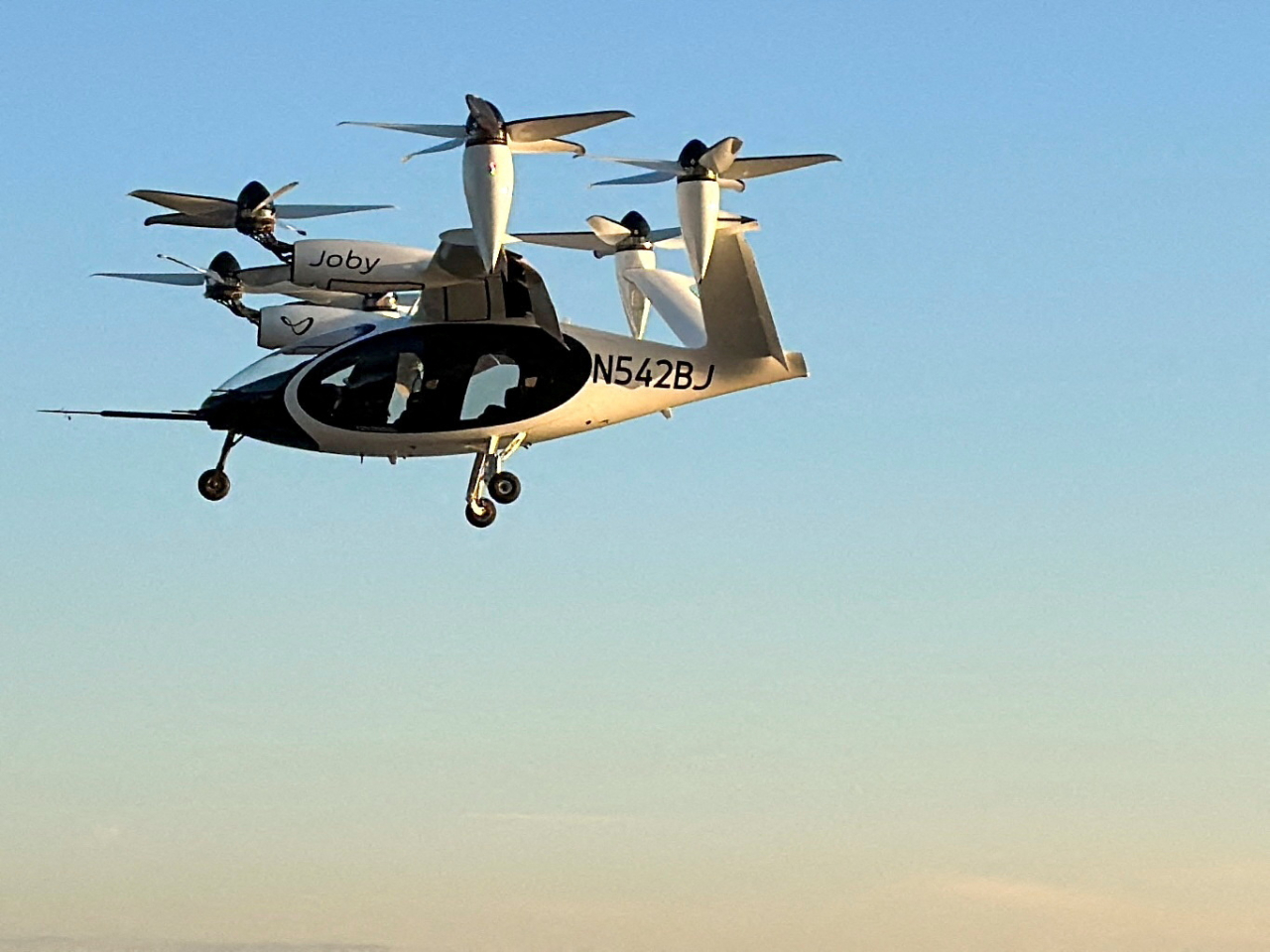 A Joby Aviation electric air taxi flies near the Downtown Manhattan Heliport in New York City. File photo: Reuters
