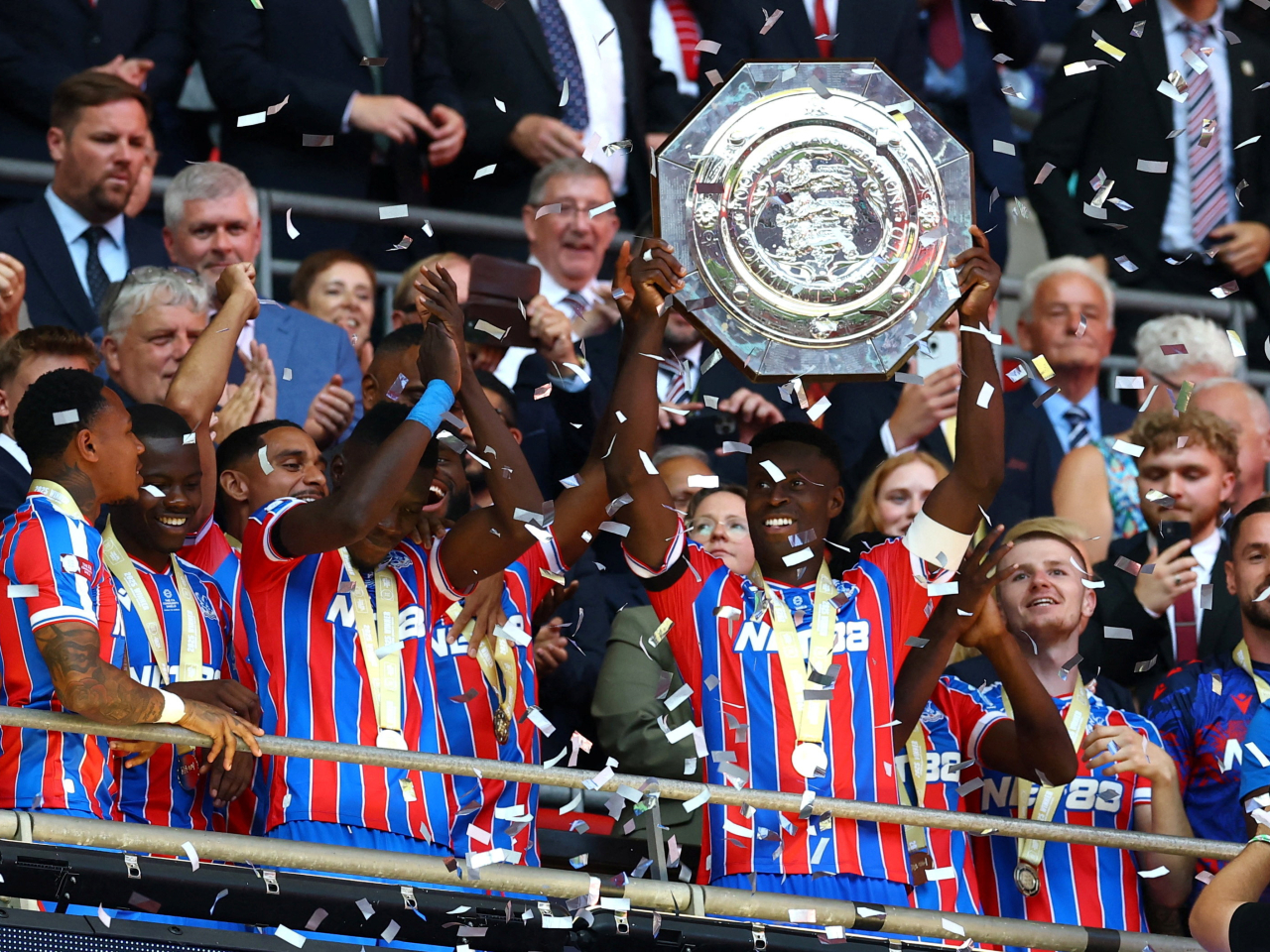 Crystal Palace's Marc Guehi lifts the trophy as he celebrates with teammates after winning the FA Community Shield. Photo: Reuters