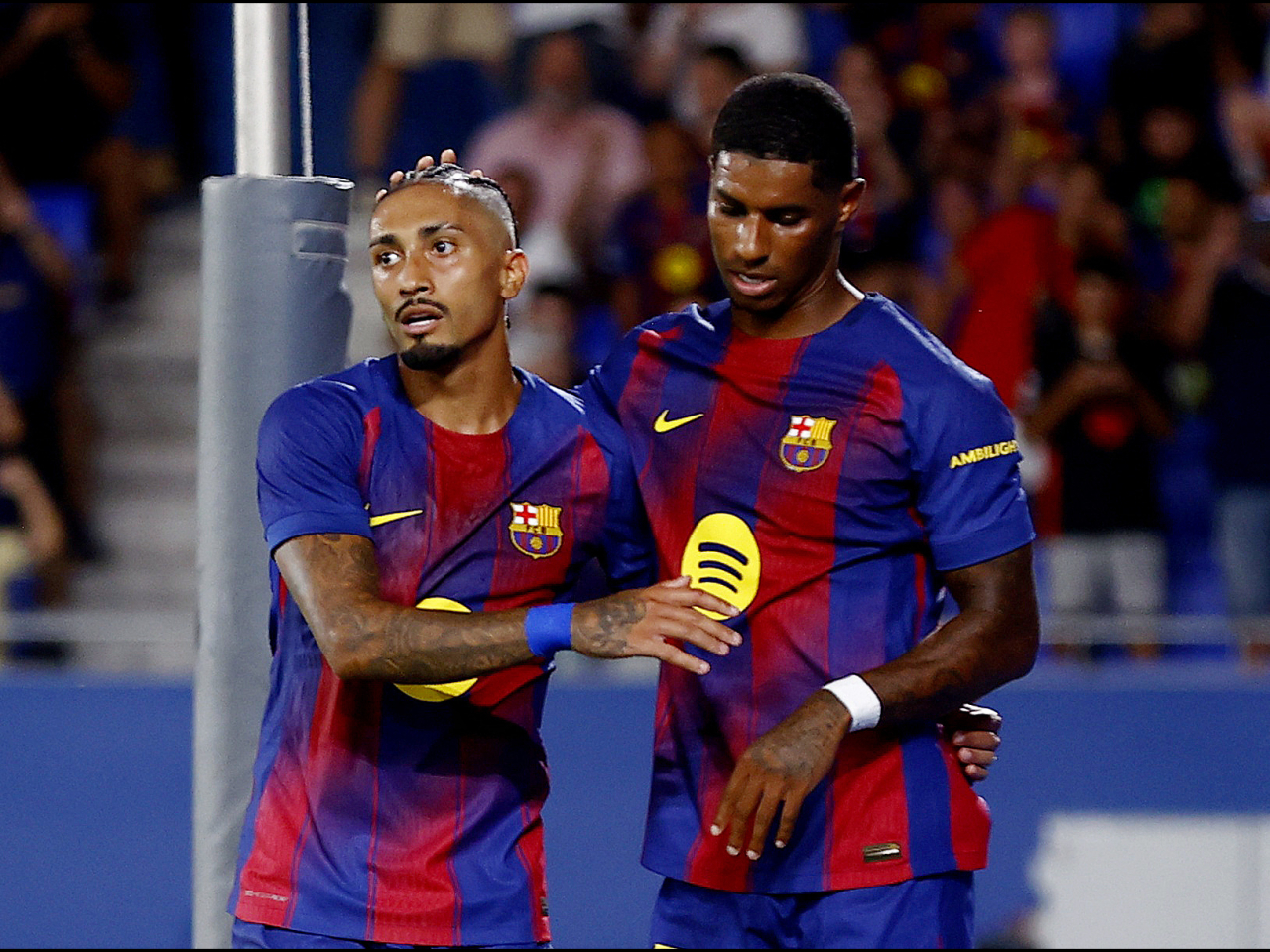 Barcelona's Raphinha, left, celebrates scoring their third goal with new signing Marcus Rashford. Photo: Reuters