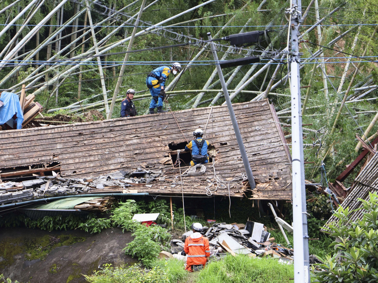 Firefighters search a collapsed house after heavy rain in Kagoshima, southwest of Kumamoto prefecture, late last week. File photo: Reuters