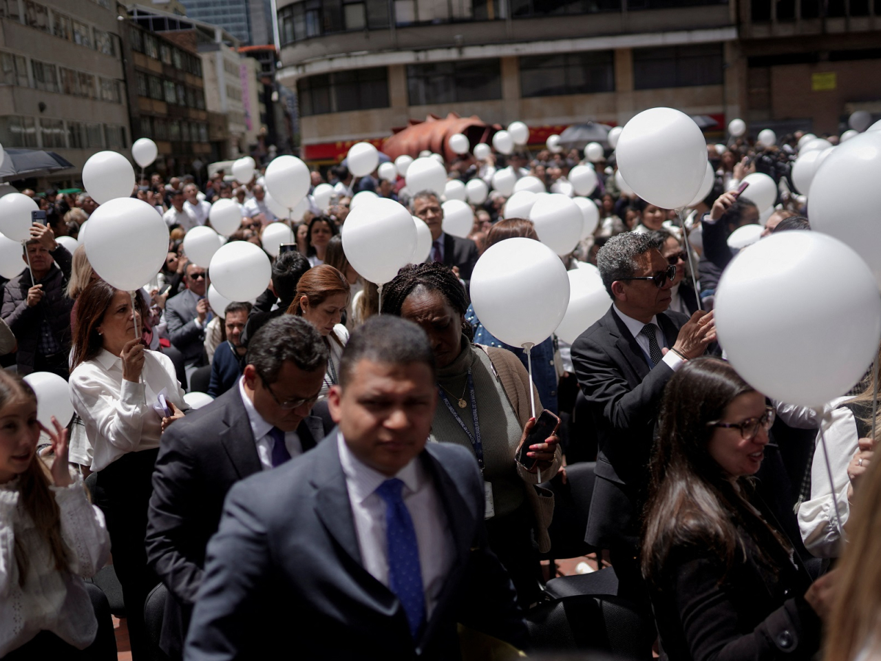 Government employees attend a ceremony for late Colombian Senator Miguel Uribe, in Bogota. Photo: Reuters