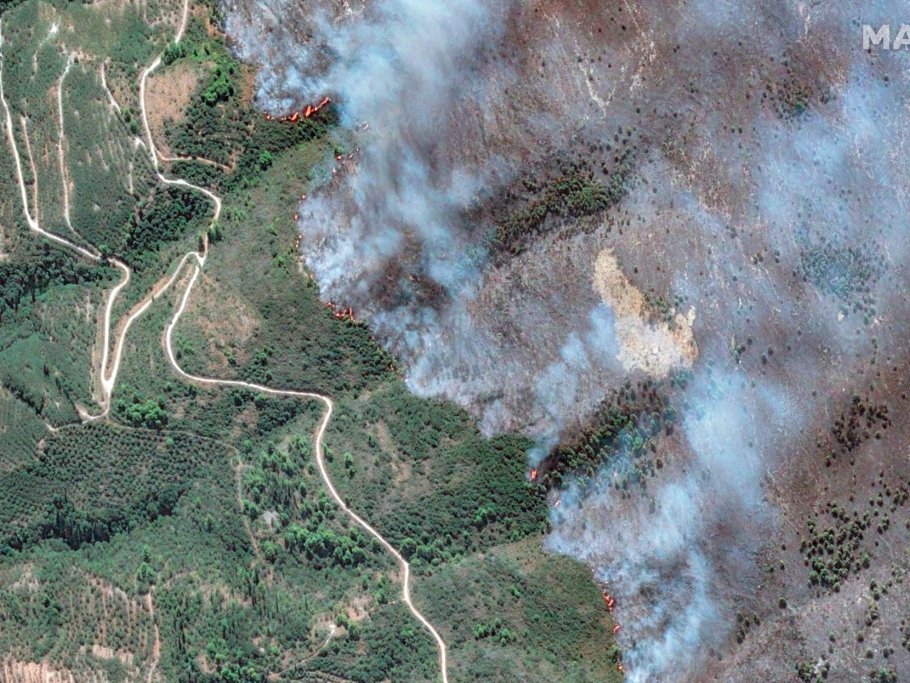A satellite image shows an active fire line during wildfires on Zakynthos Island in Greece. Photo: Maxar Technologies via Reuters
