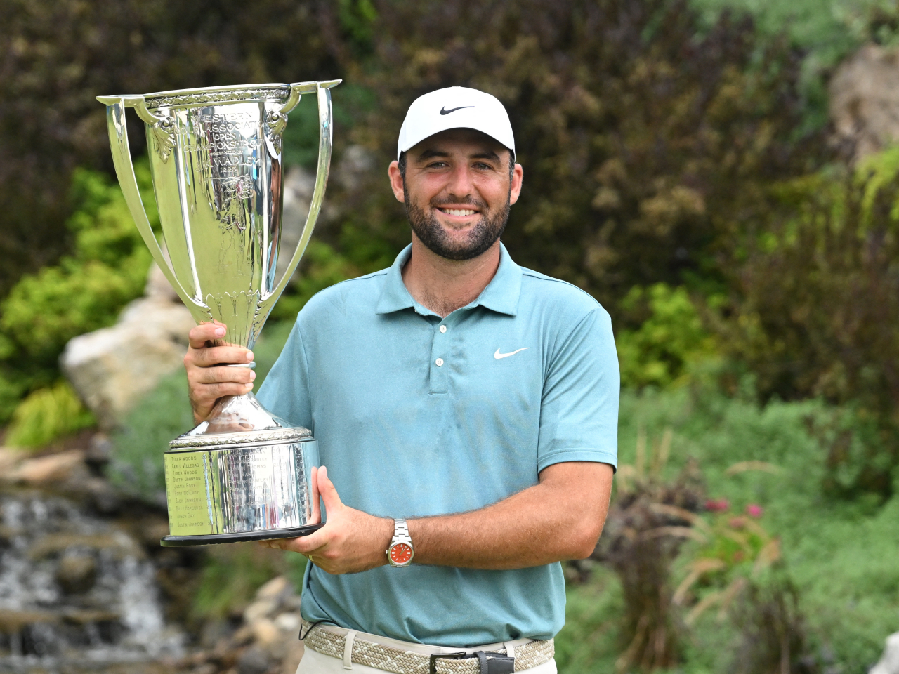 World number one Scottie Scheffler poses with the JK Wadley trophy after winning the BMW Championship. Photo: Reuters