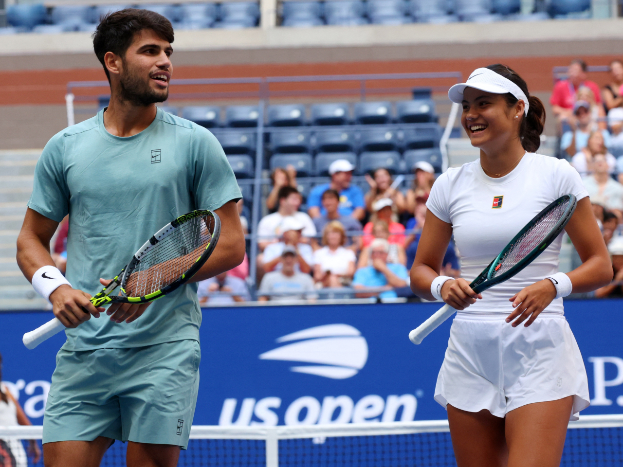 Carlos Alcaraz and Emma Raducanu were all smiles in their doubles partnership despite an early exit. Photo: Reuters