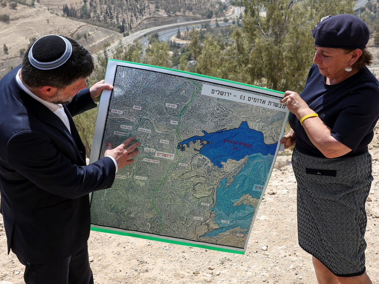 Israeli Finance Minister Bezalel Smotrich holds a map that shows the E1 settlement scheme that would split East Jerusalem from the occupied West Bank. File photo: Reuters