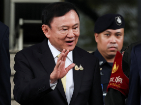 Thaksin cleared of royal insult charge