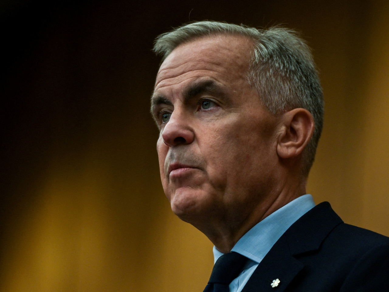 Prime Minister Mark Carney says Canadian tariffs on US autos, steel and aluminium will remain for now. Photo: Reuters