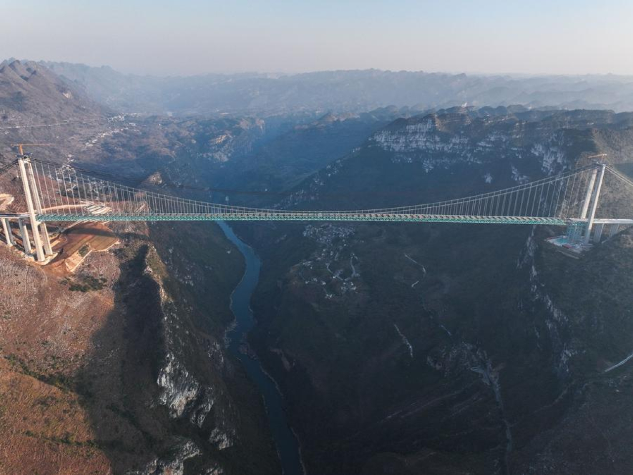The Huajiang Grand Canyon Bridge will cut a two-hour journey to just a few minutes upon completion. File photo: Xinhua