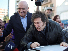 Javier Milei has accused the opposition of resorting to violence after rocks and other objects were thrown at his car during a campaign event. Photo: Reuters