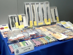 Triad chief among 155 held in organised crime raids
