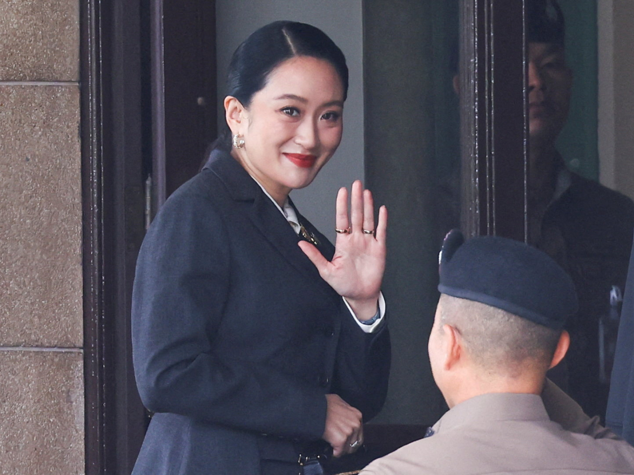 Paetongtarn Shinawatra arrives at Government House ahead of the Constitutional Court's verdict. Photo: Reuters