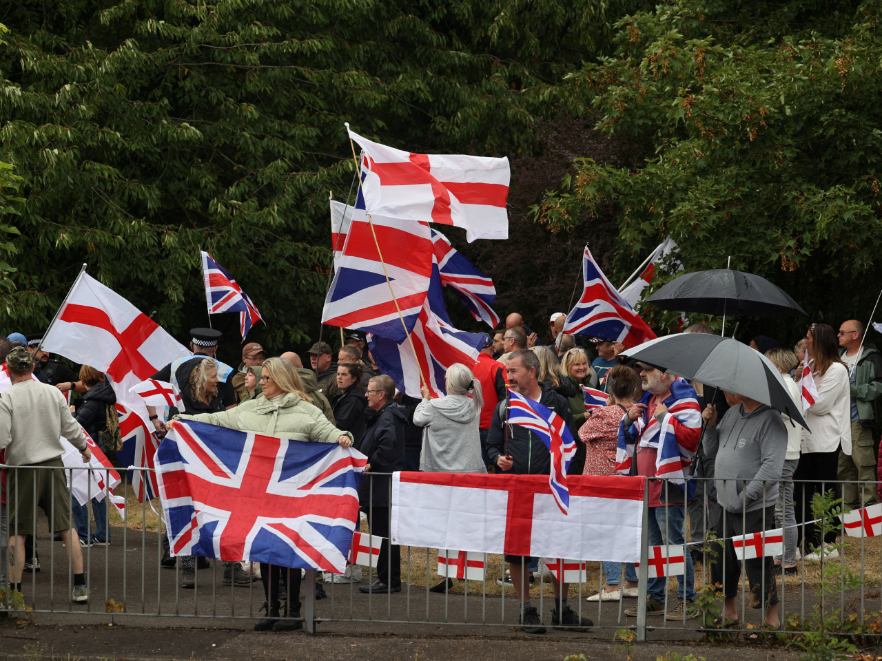 Protesters against asylum seekers gathered near the IHG Holiday Inn in Woolston, Warrington. Photo: Reuters