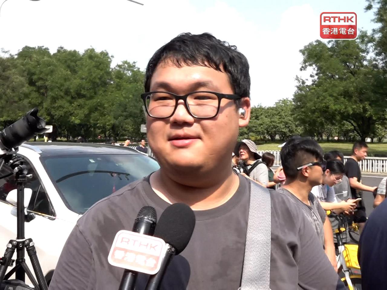 Another Beijing resident, who took photos of the arms unveiled during the parade, tells RTHK that he's happy that the weather was good. Photo: RTHK