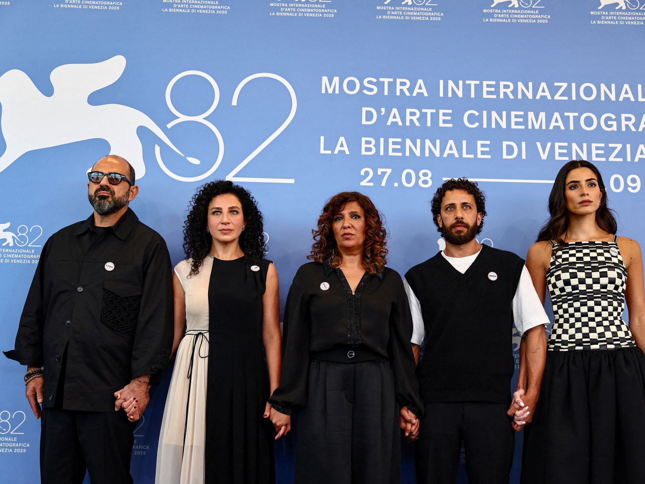 Kaouther Ben Hania (centre) and Saja Kilani (right) pose during a photocall for the movie "The Voice of Hind Rajab" at the 82nd Venice Film Festival. Photo: Reuters