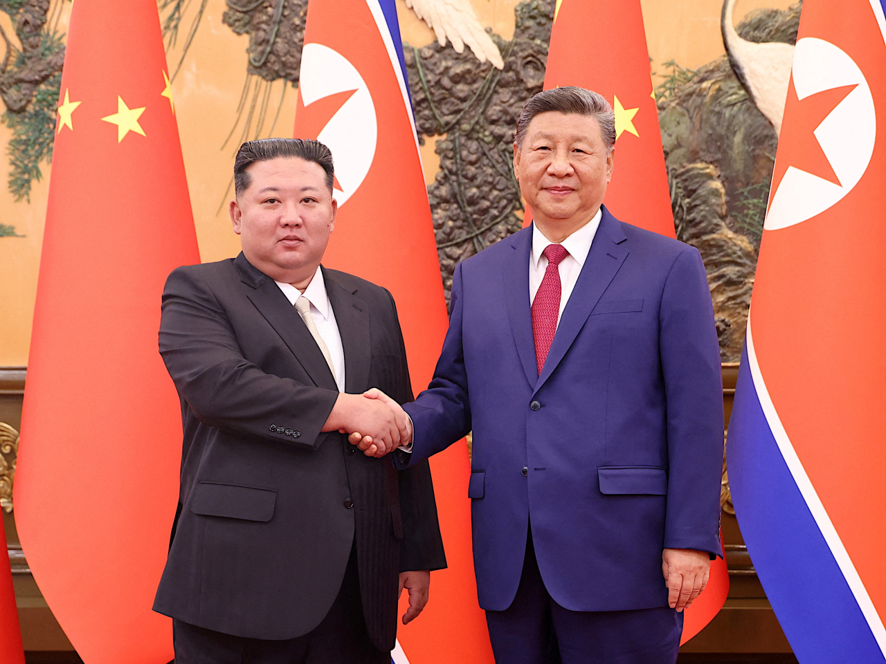 習近平昨晚在人民大會堂與金正恩會面，是兩人相隔六年再次舉行雙邊會談。（路透社）