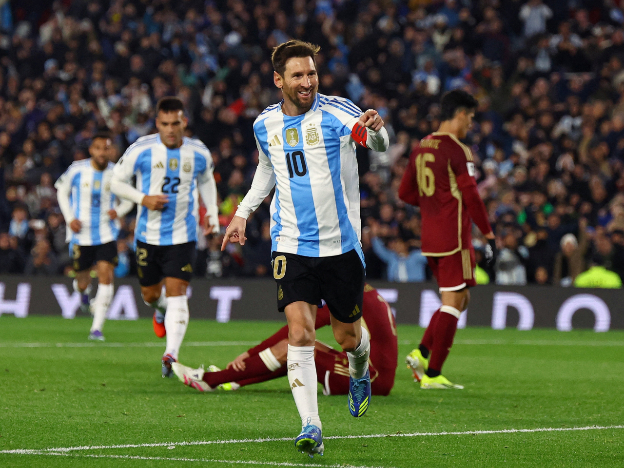 Lionel Messi celebrates scoring his second goal against Venezuela in Buenos Aires. Photo: Reuters