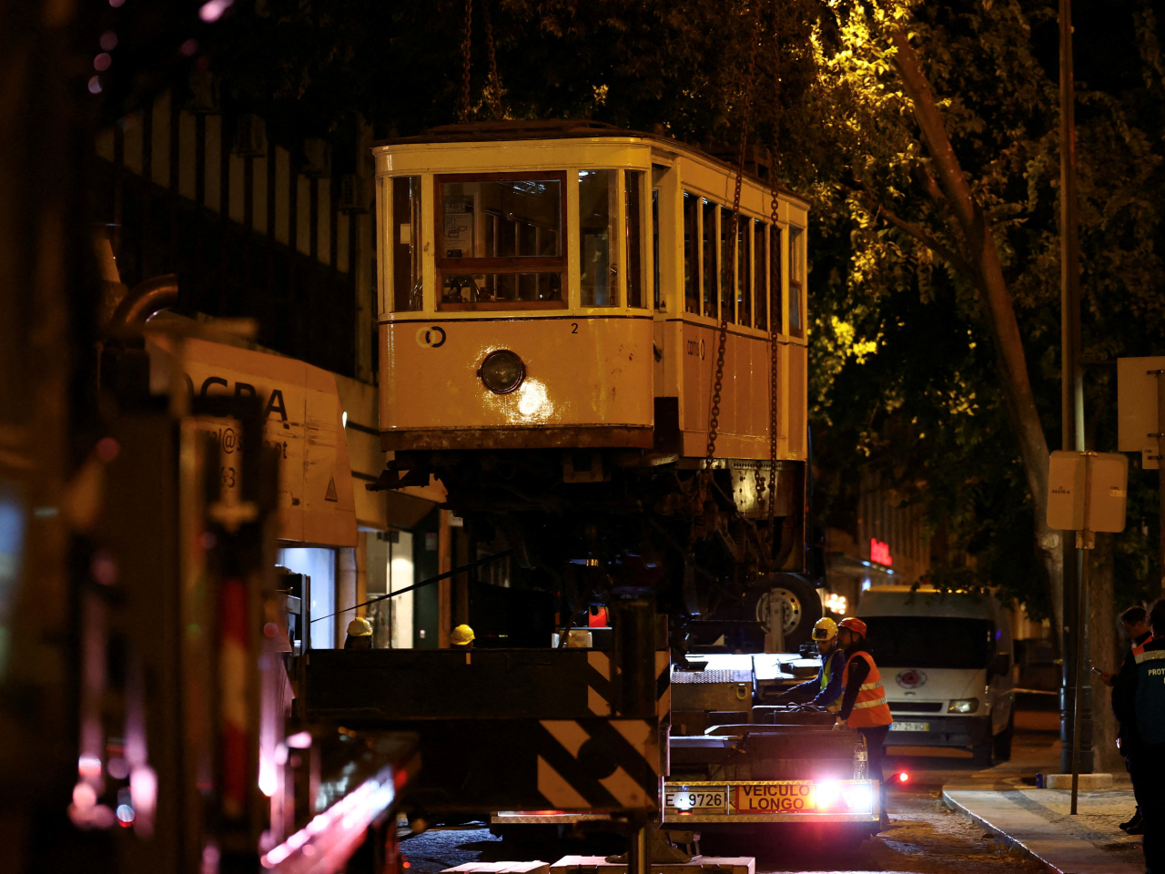 One of the funiculars is lifted, following derailment and crash of the Gloria funicular railway car which resulted in multiple casualties. Photo: Reuters