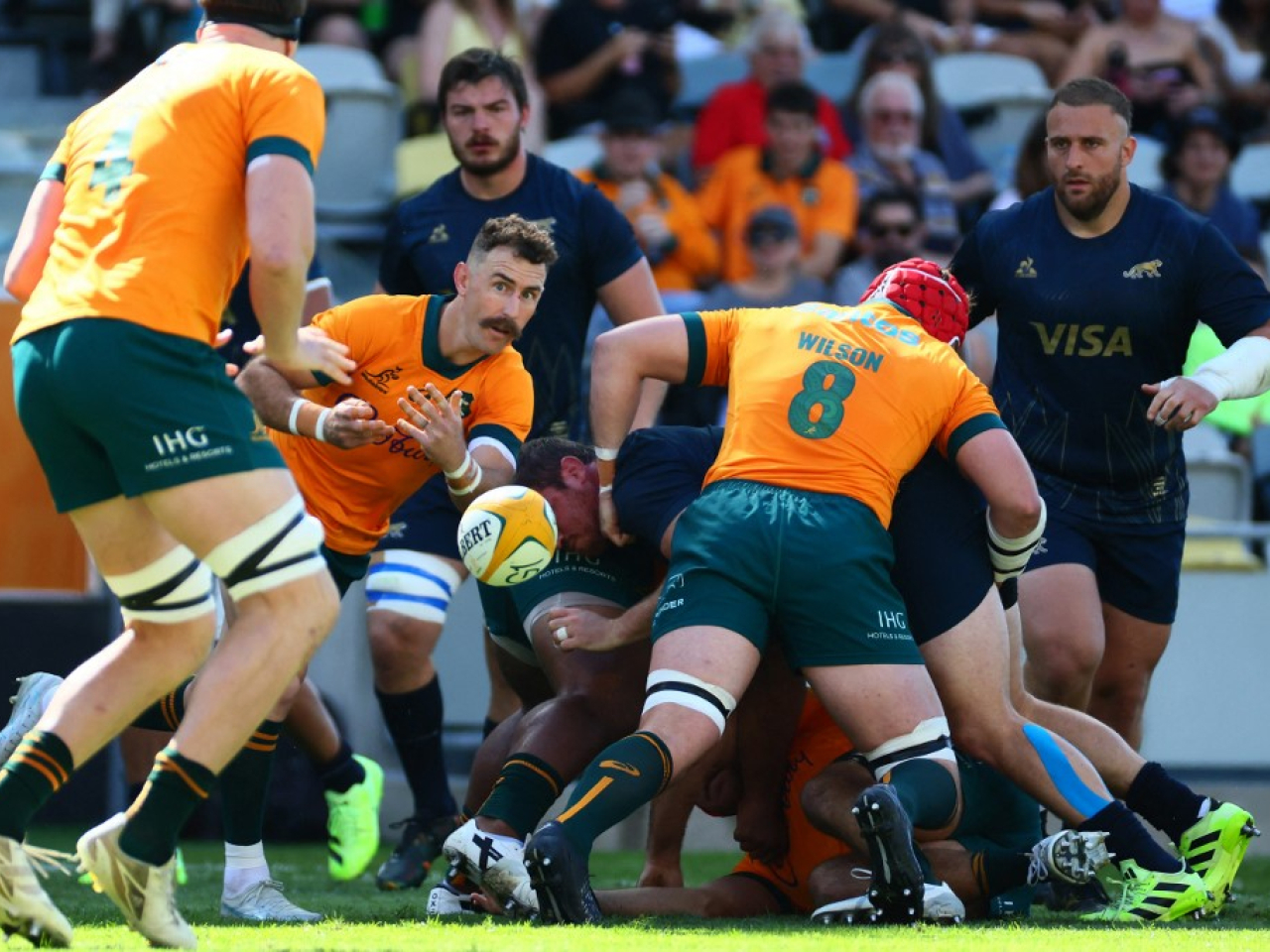 Nic White passes the ball during a scrum in the game between Australia and Argentina in Townsville. Photo: AFP