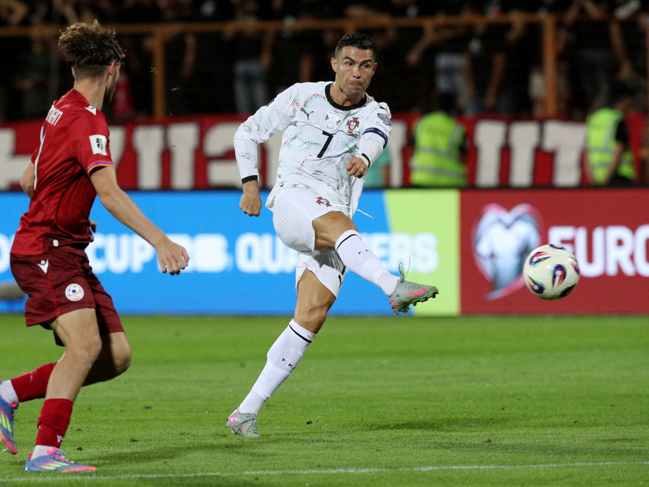 Portugal's Cristiano Ronaldo scores their fourth goal against Armenia. Photo: Reuters