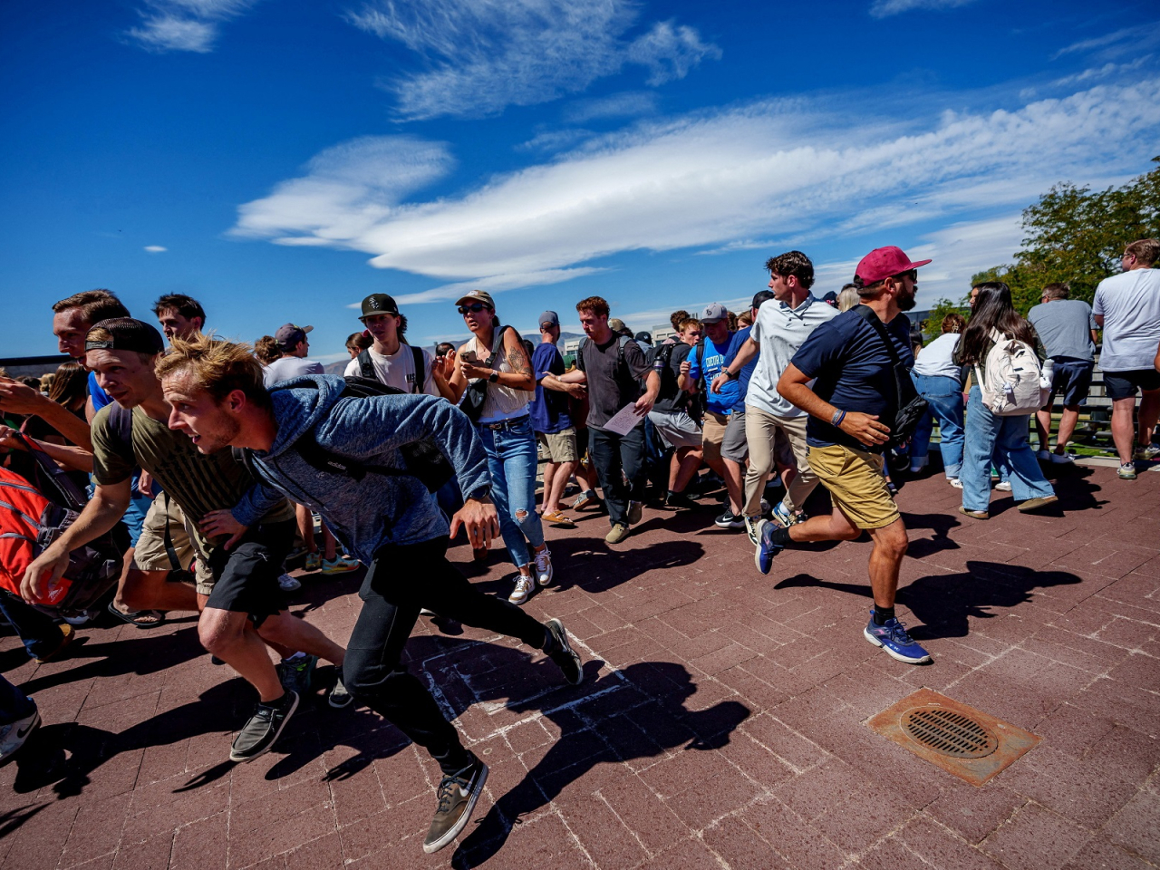 People attending the event ran for cover after a shot was fired at the right-wing activist and commentator. Photo: Reuters