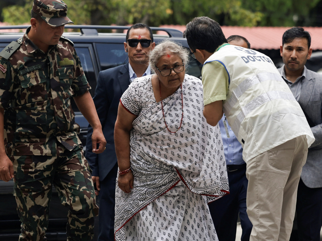 Nepal’s newly appointed Prime Minister Sushila Karki arrives at a hospital to meet some of those injured in last week's deadly anti-corruption protests. Photo: Reuters