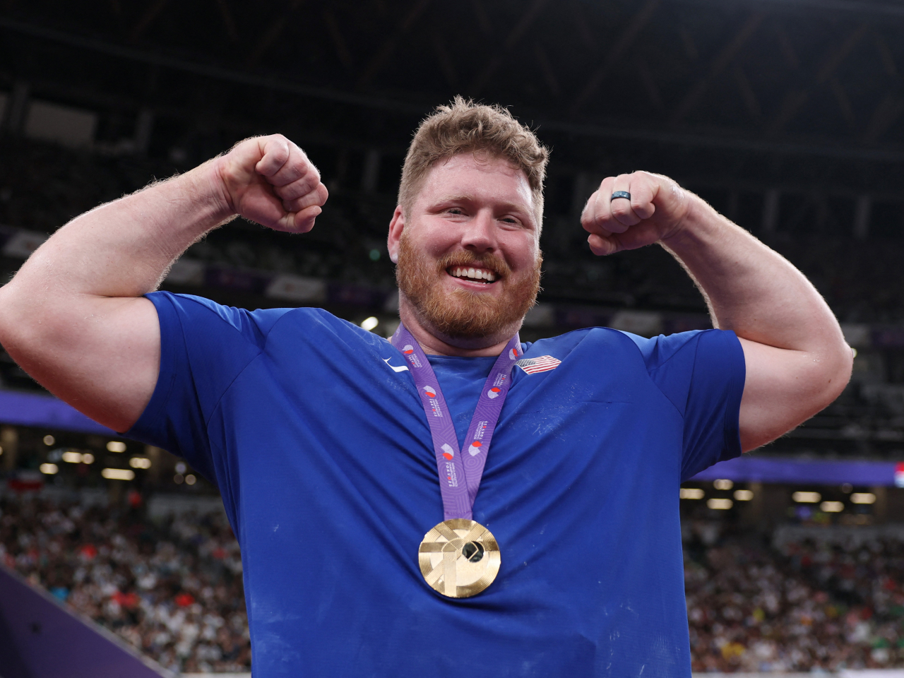 Ryan Crouser of the US celebrates winning gold, becoming one of the most dominant shot putters of his generation. Photo: Reuters