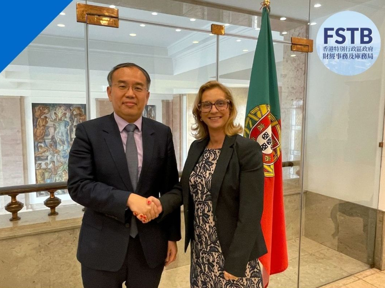 Seen here paying a visit to Portugal a year ago, Christopher Hui says the SAR will be removed from the country's "tax haven list" from the start of next year. File photo courtesy of Information Services Dept.
