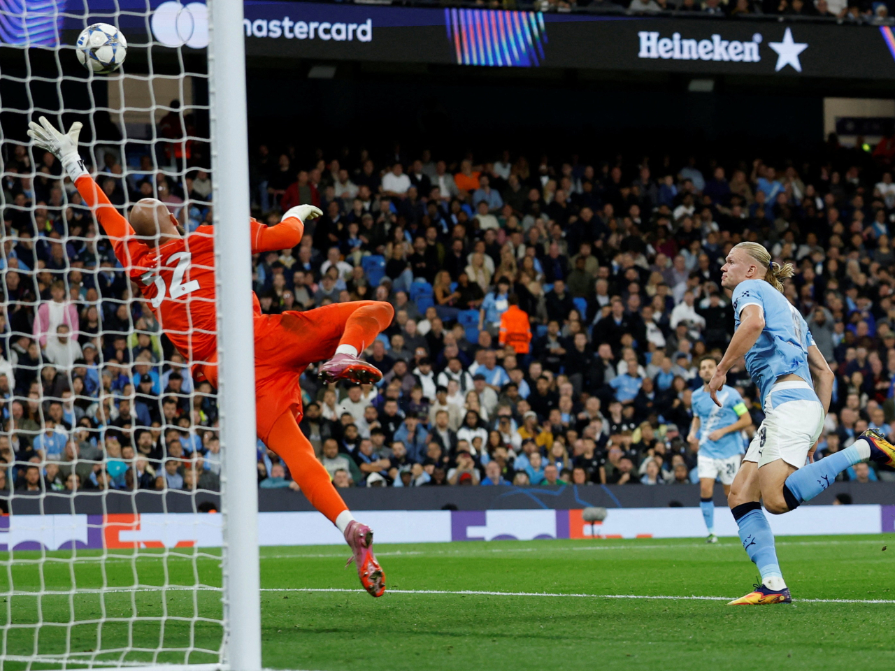 Erling Haaland became the fastest player to tally half a century of Champions League goals in Manchester City's 2-0 win over Napoli. Photo: Reuters
