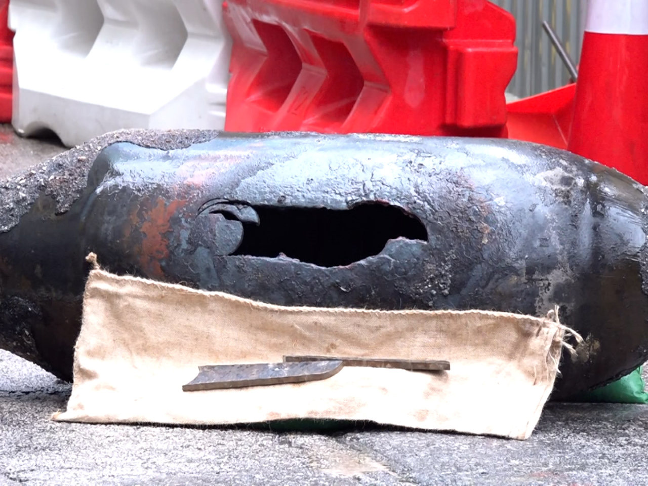 Bomb-disposal officers spent four hours cutting open the 1,000-pound bomb in bad weather before the threat it posed ended. Photo courtesy of HK police force