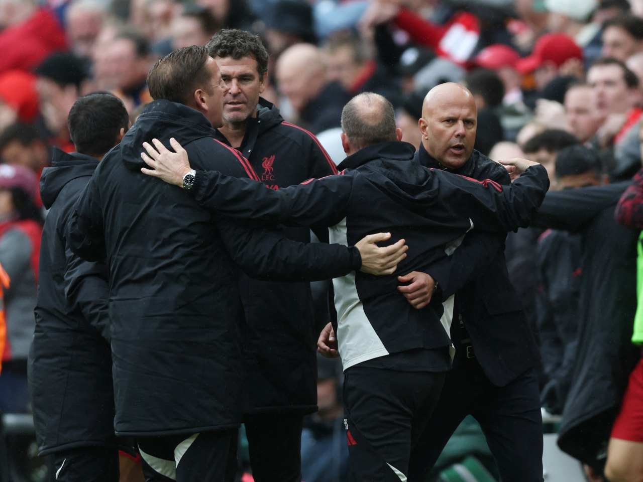 Liverpool manager Arne Slot (right) celebrates with his coaching staff after beating Everton to make it five wins from five games. Photo: Reuters