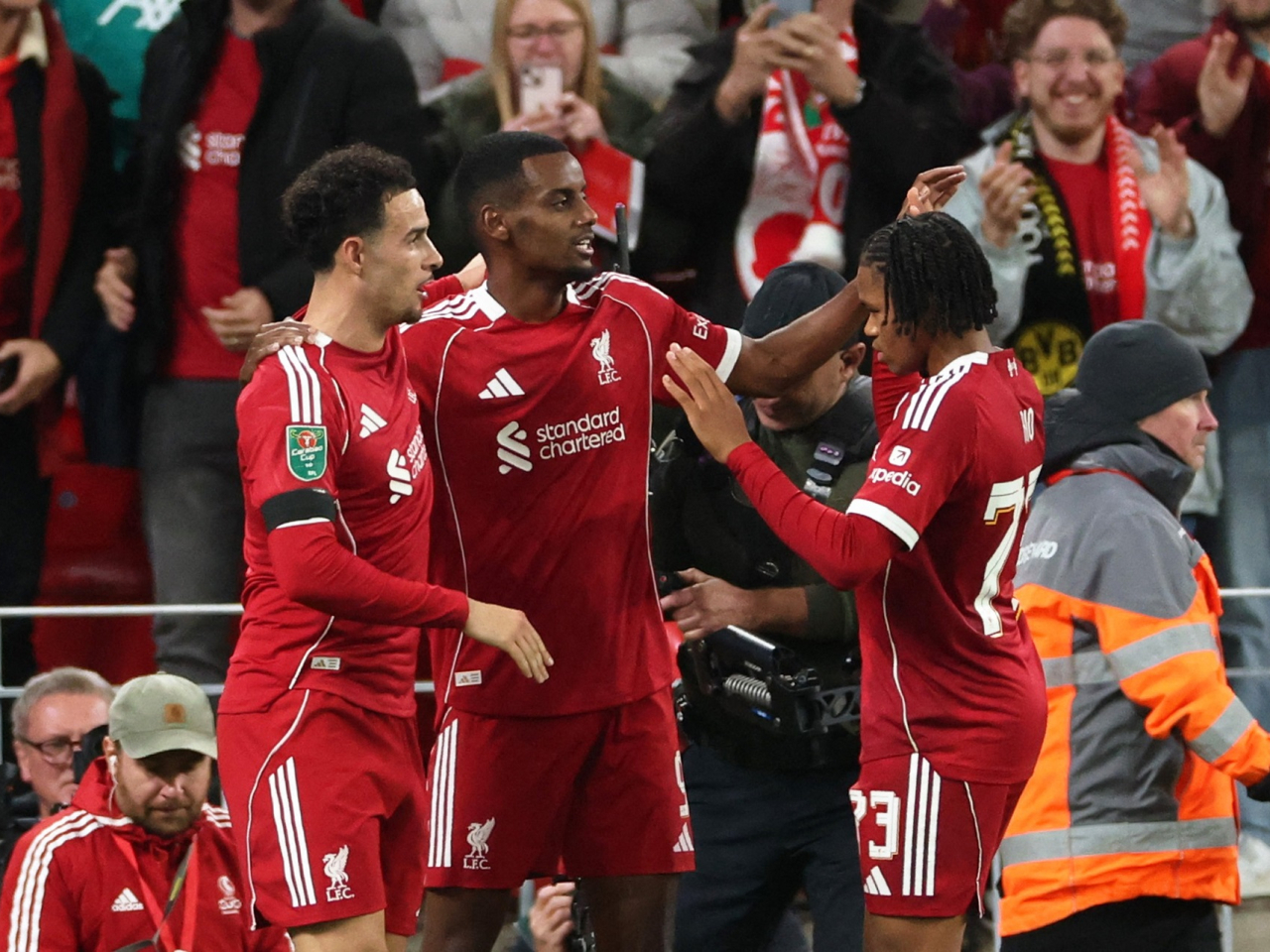 Alexander Isak celebrates scoring his first goal with Liverpool alongside Curtis Jones and Rio Ngumoha. Photo: Reuters
