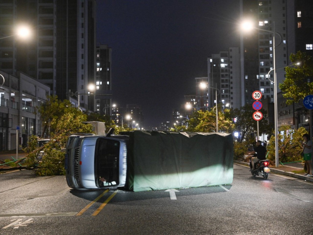 A truck is left on its side in Yangjiang by fierce winds in the wake of Ragasa's passage. Photo: AFP