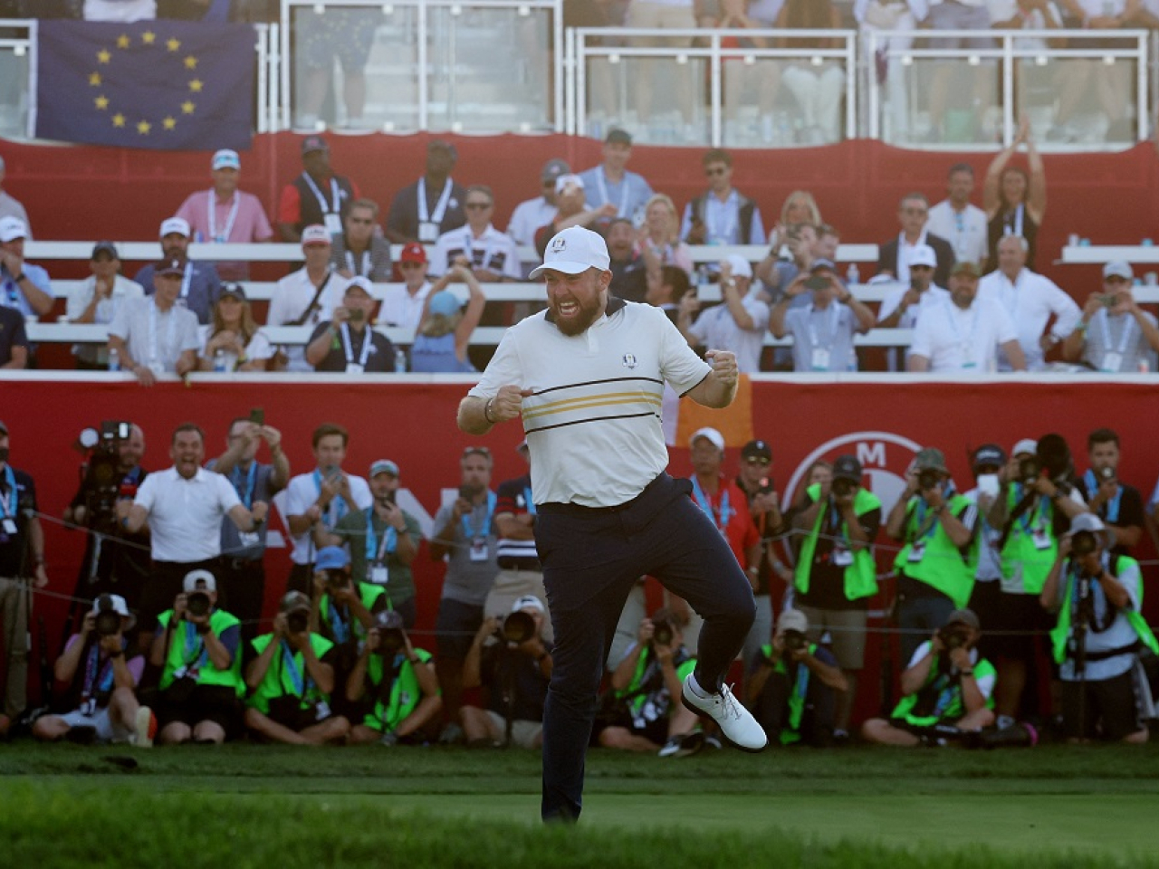 Shane Lowry dances with delight after holing his putt on the 18th. Photo: Reuters