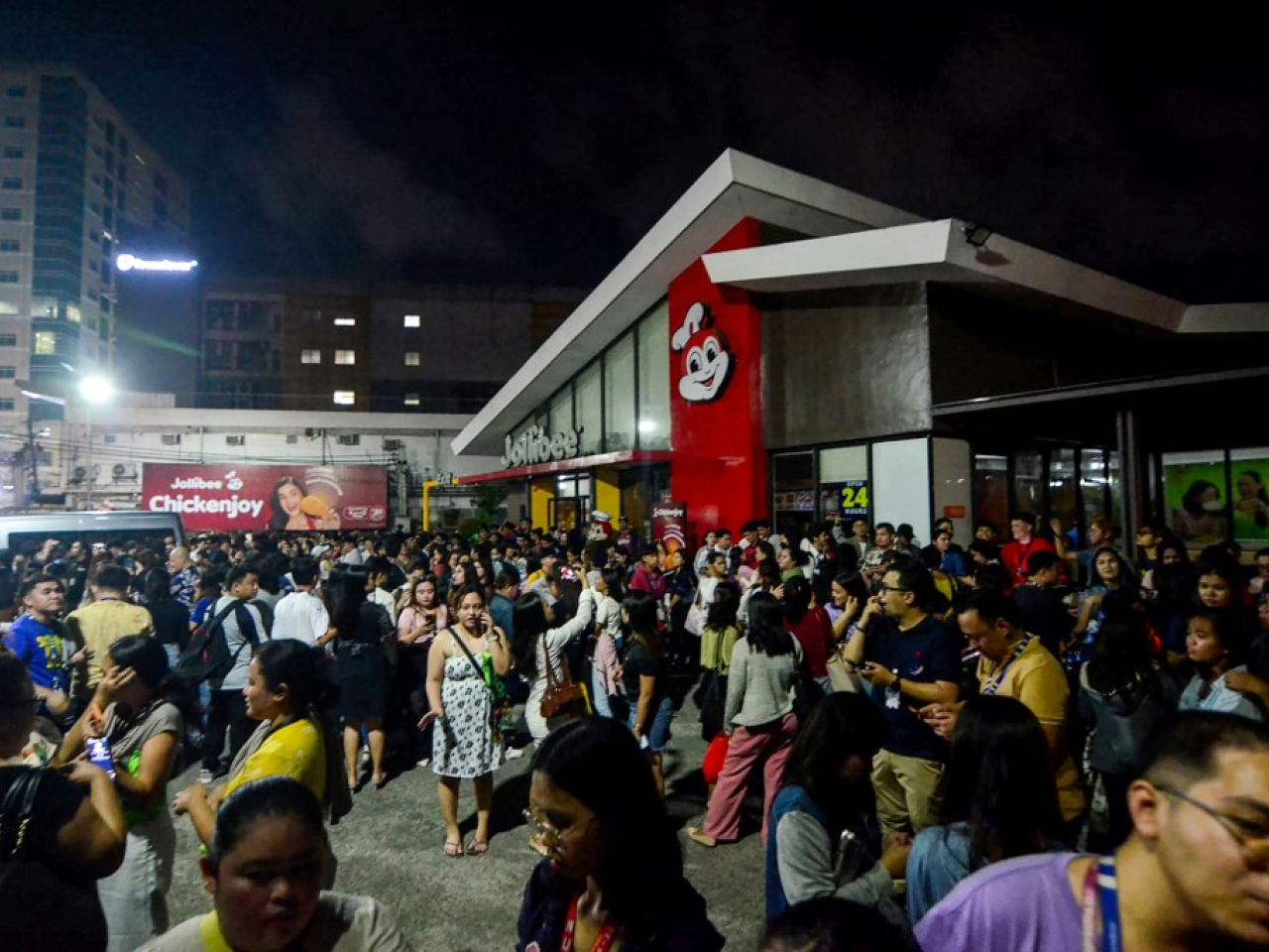People gather in the street after the earthquake hit. Photo: AFP