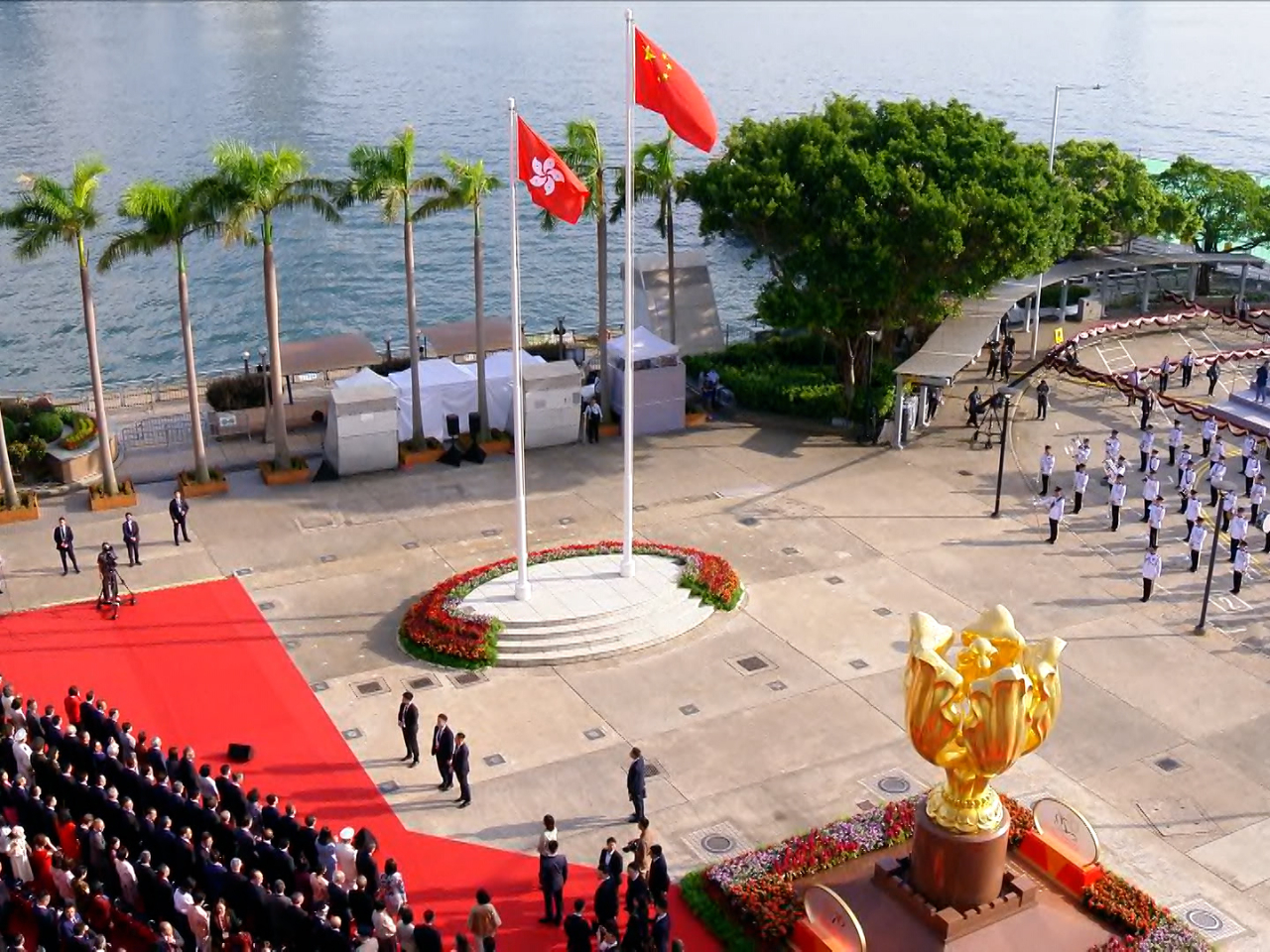 A flag-raising ceremony is held at Golden Bauhinia Square in Wan Chai to mark National Day. Photo: RTHK
